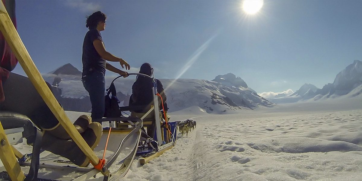 A group of people riding on the back of a bike.