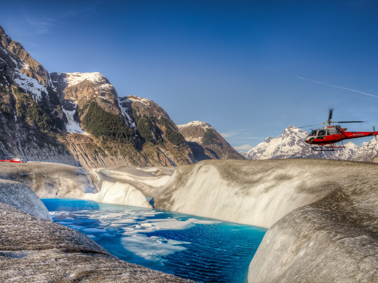 a man riding a wave on top of a mountain