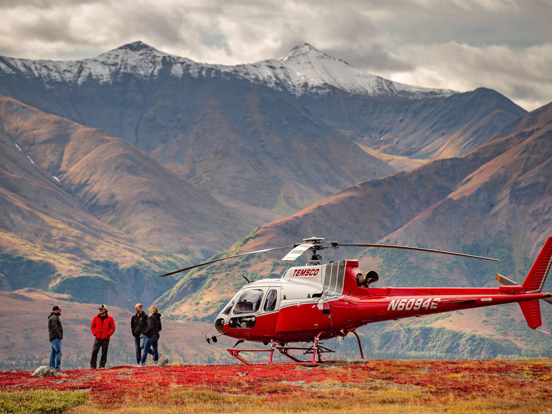 a plane with a mountain in the background